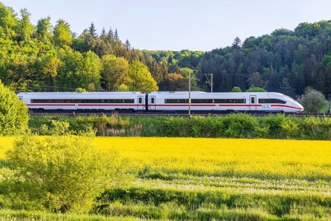 InterCityExpress ICE travelling across the Swabian Alb. Idyllic landscape in spring. Lonsee,