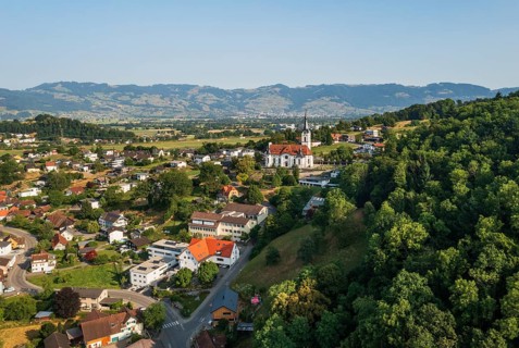 Drone image, view of town with parish church, Koblach, Rhine Valley, Vorarlberg, Austria