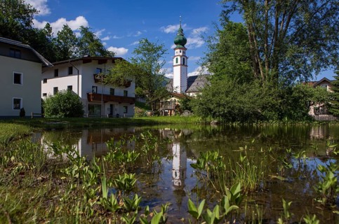 View of the village with parish church, Breitenbach am Inn, Inntal, Tyrol, Austria