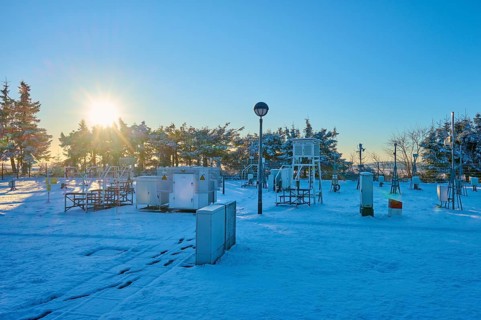 Weather station with snow-covered facilities at sunrise, winter, Wasserkuppe, Gersfeld, Rhön,