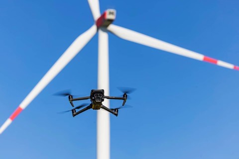 A Mavic 3 Pro drone flies for a wind turbine in a wind farm. Dornstadt, Baden-Württemberg, Germany