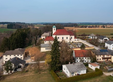 Drone shot, view of village, parish church, Schiedlberg Traunviertel, Upper Austria, Austria
