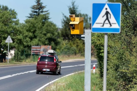 Speed camera and pedestrian crossing road sign