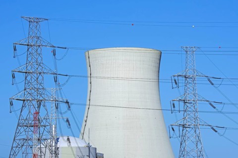 Cooling tower of the Doel Nuclear Power Station, nuclear power plant and high-voltage electricity
