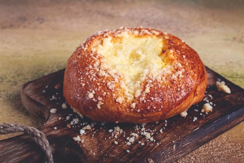 Bun with cottage cheese, pastries, cheesecake, no people