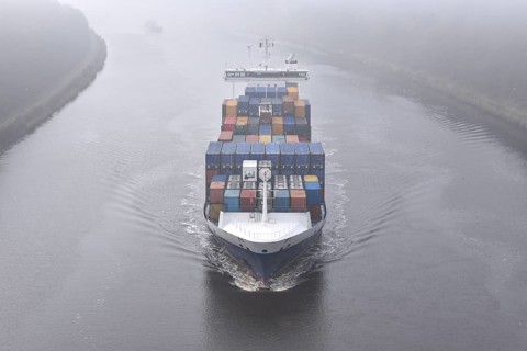 Container ship BALTIC WHALE sails through the Kiel Canal in fog, NOK, Kiel Canal, Kiel Canal,