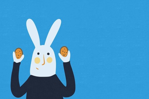 A playful illustration of a white Easter bunny holding chocolate eggs against a blue backdrop. The