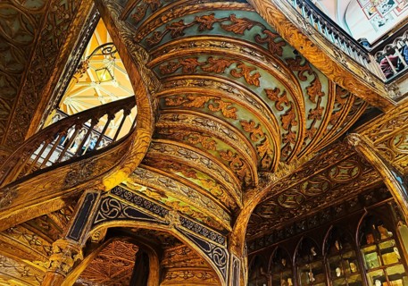Livraria Lello, interior view of the Lello bookstore with rich decorations of the curved wooden