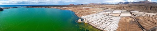 Salt mining plant, Salinas de Janubio with green Laguna de Janubio, near Yaiza, aerial view,