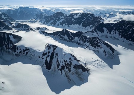 Snow and ice, epic mountains with glaciers, aerial view, Alaska Range, Denali National Park,