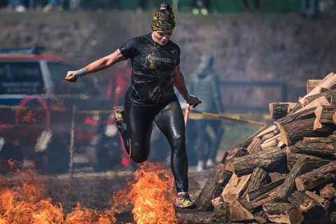WROCLAW, POLAND - APRIL 7, 2018: Extreme running with obstacle RUNMAGEDDON. In the picture a runner
