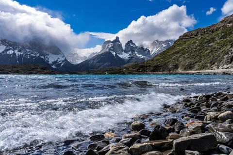 Cuernos del Paine, snow-capped peaks of the Paine massif behind turquoise Lake Nordenskjöld with