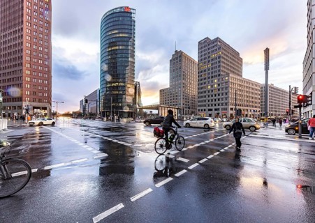 Potsdamer Platz Berlin in the evening with traffic on the streets. When it rains, the skyscrapers