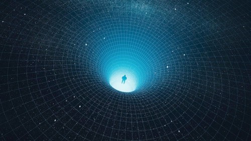 A man stands at the edge of a black hole, gazing into the depths of the universe, surrounded by