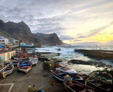 Fishing boats rest on the pier during a peaceful sunset, Ponta do Sol, Santo Antao, Cabo Verde,