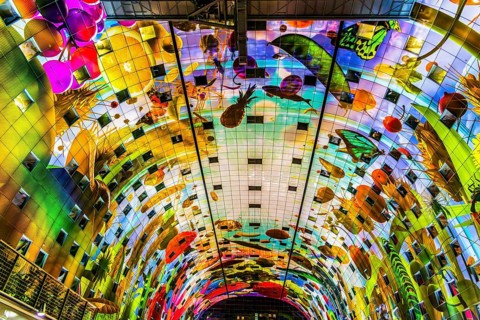 Markthal from 2014, offers over 100 food stalls and delicatessens with spectacular ceiling fresco
