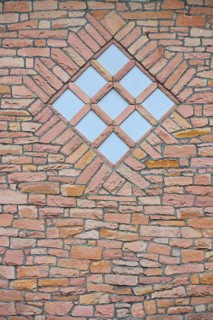 Quarry stone wall with a diamond-shaped window-shaped pattern, spa garden, Kurstadt Bad Orb,