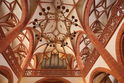 Organ and chandelier with gallery, late Gothic Rheingau Cathedral, looking up, interior view,