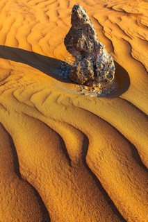 Boulders surrounded by wind-blown sand structures, Huqf stone desert, Arabian Peninsula, Sultanate