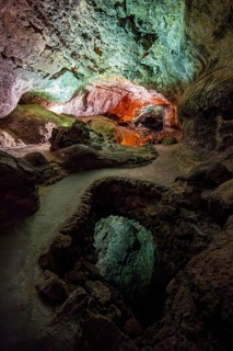 Underground cave formed by lava flow, illuminated lava tunnel, Cueva de los Verdes, Lanzarote,
