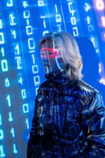 An elderly Asian woman wearing virtual reality glasses, exploring the dynamic and immersive world