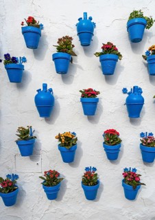 Blue flower pots on whitewashed wall, Castle of Iznajar, Castillo de Iznájar, Andalusia, Spain