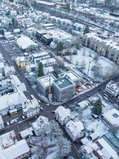 Snowy urban crossroads with modern and traditional buildings, Nagold, Black Forest, Germany