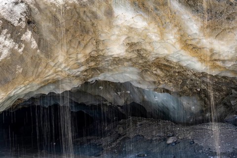 Meltwater at a glacier cave, underground glacier stream, Castner Glacier, Delta Range, Alaska