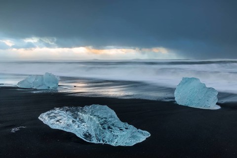 Ice chunks on the black beach, lava beach, glacier ice, sea, winter, sunset, Diamond Beach
