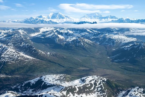 Clouds over high mountains, Mt Foraker and Mt Denali or Mount McKinley, aerial view, Alaska Range,