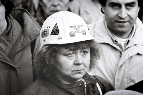 With tears in her eyes, an employee follows the works meeting for the closure of Krupp Rheinhausen,