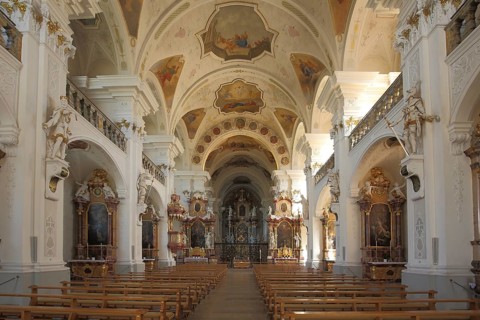 Magnificent interior view of baroque monastery church, frescoes, ceiling paintings, decorations,