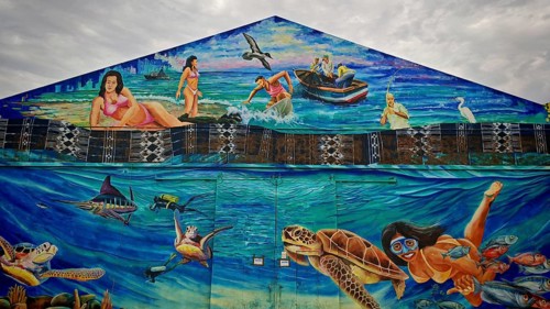 Maritime mural, mural, graffiti depicting people, marine animals and the ocean in vivid colors,