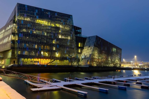 Back of Harpa concert hall, Tónlistar- og ráðstefnuhúsið í Reykjavík, boat dock, blue hour, winter,