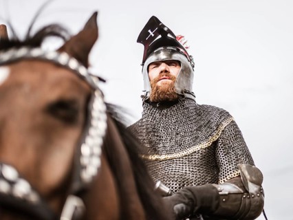 LUBIAZ, POLAND - AUGUST 25, 2018: Monastery Siege - historical staging. Portrait of knight on the
