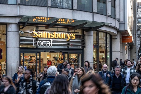 London, UK. February 25th 2026. A crowded busy street outside a Sainsbury Local retail supermarket