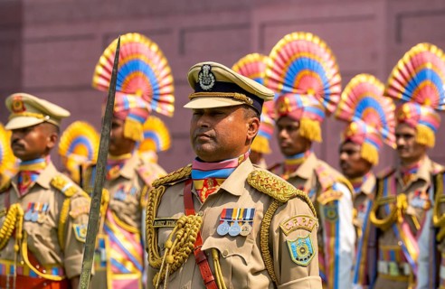Central Reserve Police Force (CRPF) personnel wearing ceremonial headgear stand in formation during
