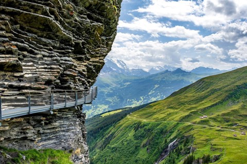 Tourist attraction First Cliff Walk, metal trail on a rocky outcrop, Grindelwald First, in front of