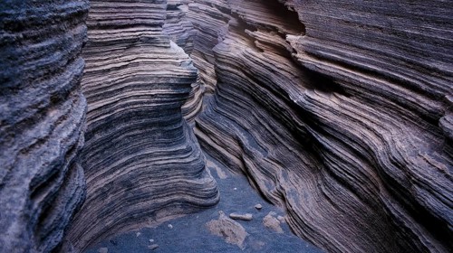 Image showcases the intricate layers and textures of volcanic rocks within Lanzarote Island,