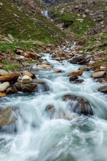 Waterfall in Himalayas mountains in Koksar, Lahaul Valley, Himachal Pradesh, India