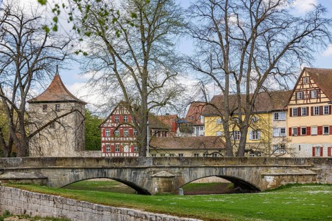 Steinerner Steg. Ensemble of buildings on the Kocher with grass trees. City view of Schwäbisch