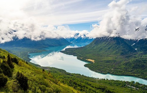 View of snowy mountains in spring and turquoise blue Kenai Lake, Slaughter Ridge Trail, Cooper