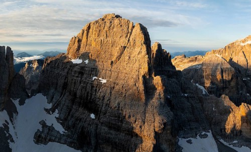 Impressive mountain peaks of the Brenta Mountains, sunrise, 360 degree alpine panorama, aerial
