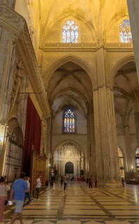 Sumptuous church interior with high vault and historic windows, Seville, Andalusia, Spain