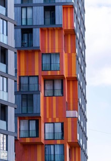 This image highlights modern architectural elements, featuring a mix of glass, concrete, and metal