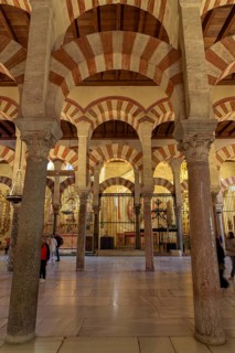 Series of decorative arches and massive columns in the Cathedral Mosque of Córdoba
