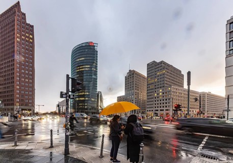 Potsdamer Platz Berlin in the evening with traffic on the streets. When it rains, the skyscrapers