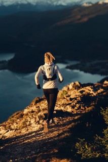 Trail running in autumn on the Jochberg on Lake Walchensee against the wonderful backdrop of the