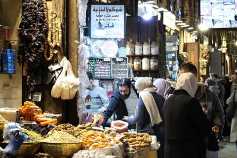Syrians shop at the historic Al-Hamidiyah Bazaar adjacent to the Umayyad Mosque during the early
