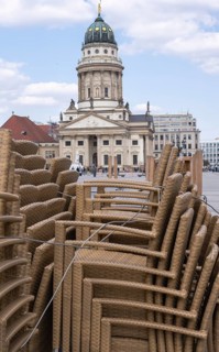 Stacked up chairs from local restaurants on the Gendarmenmarkt, Berlin, Germany
